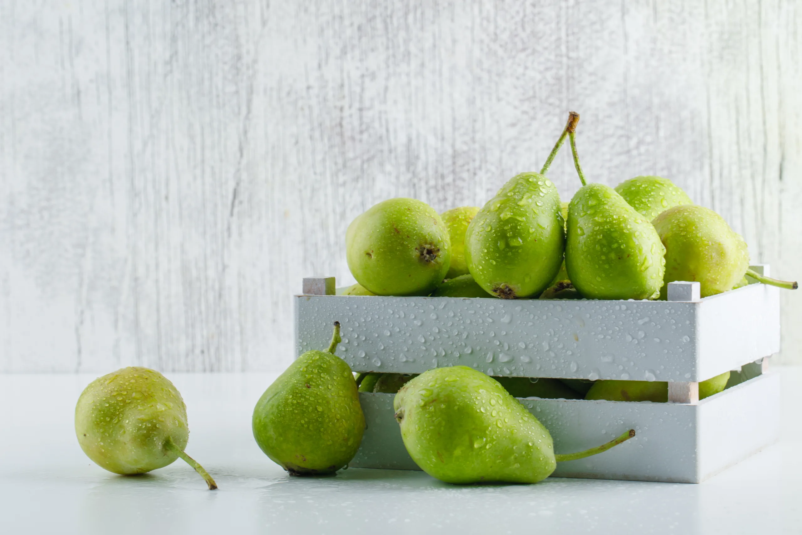 pears in wooden tray